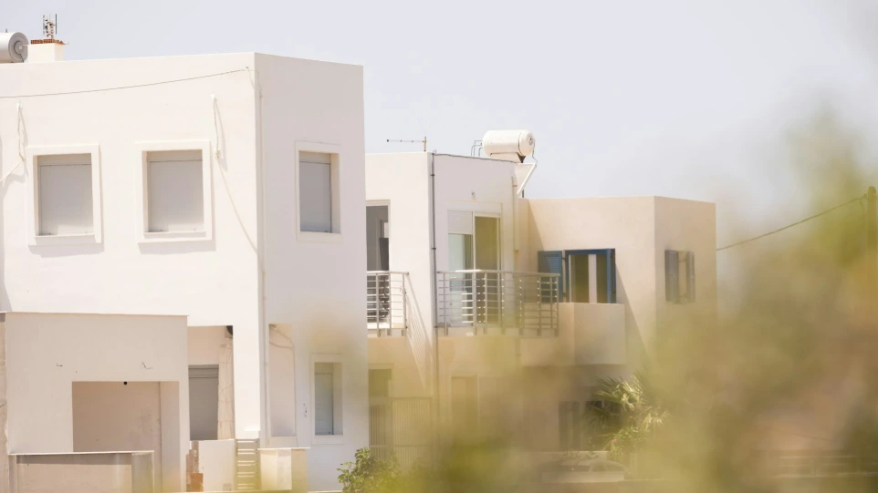 a white building with balconies and balconies on top of it
